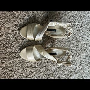 Open toe women's heels in champagne colored silk.